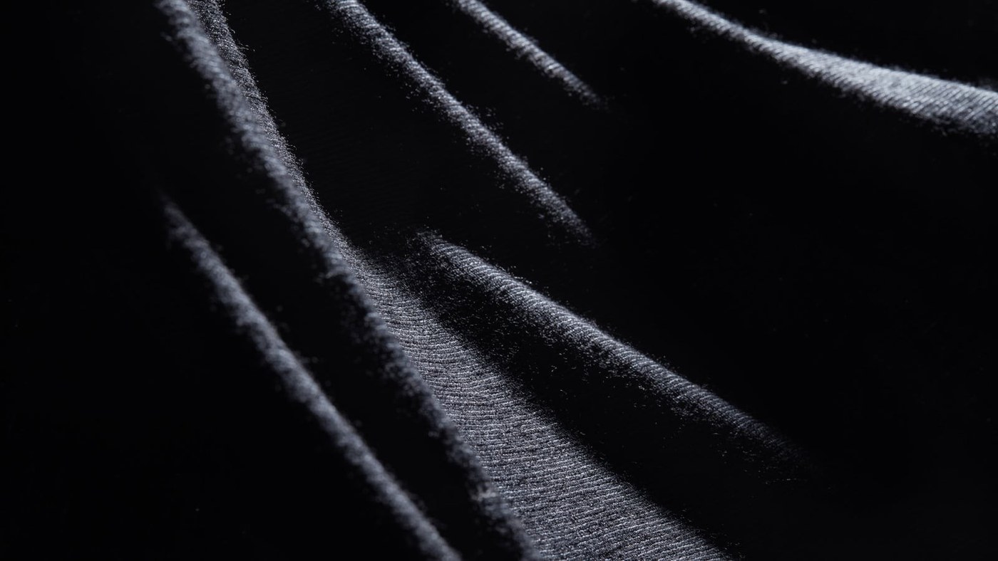 Wool's Crimp and Moisture Uptake Support Different Comfort Functions