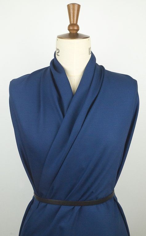 Blue wool twill fabric draped on a dress form in the source guide.