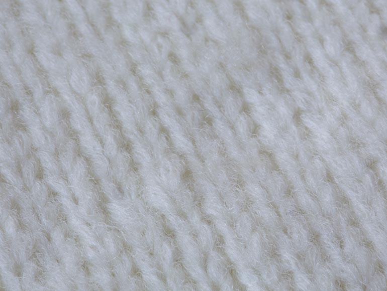 Merino Air Holds Wool Fiber Inside a Fine Knitted Tube