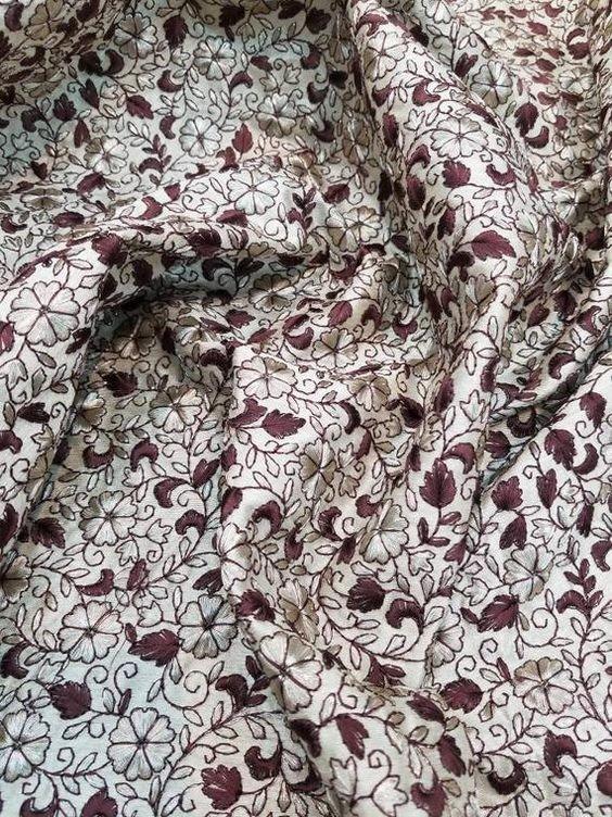 Embroidered shantung fabric pictured in the source guide; embroidery is distinct from the slubbed base texture.