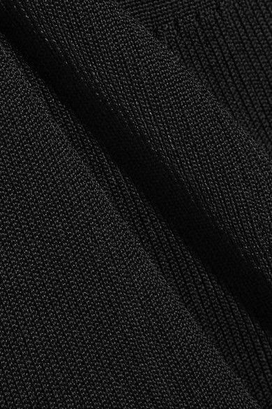 Black textured fabric pictured in the crepe source guide.