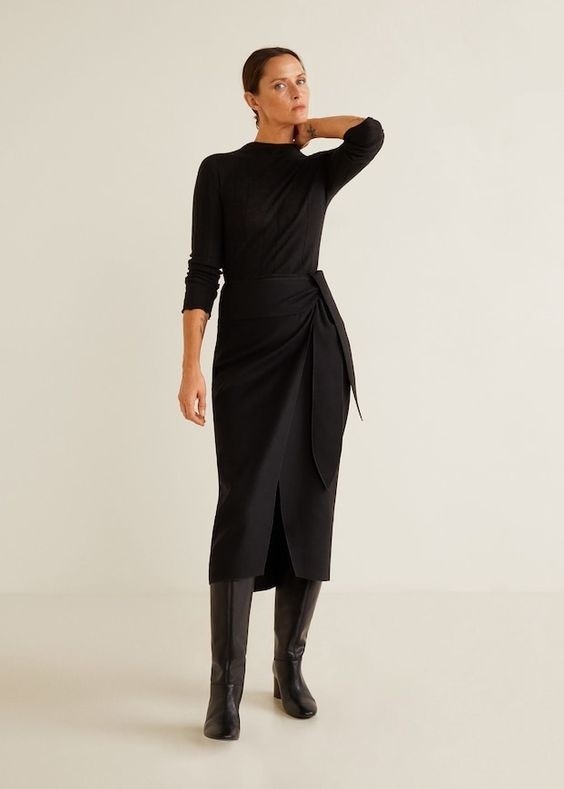 Dark alpaca-blend garment pictured in the source guide; the garment uses a blend rather than an implied pure-fiber specification.