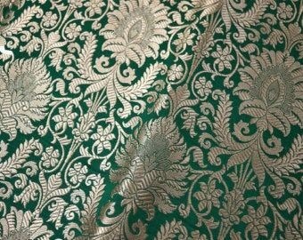Green and gold ornamental textile pictured in the source guide to brocade.