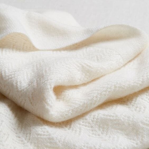 Cashmere baby blanket pictured in the source guide.